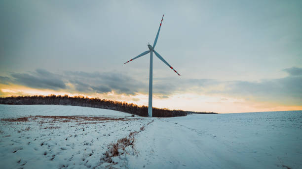 istock windmill in a snowy field with a cloudy sky in the background 1485368195