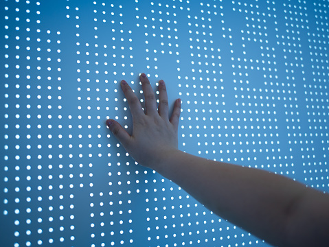 Conceptual image using hand to touch screen
