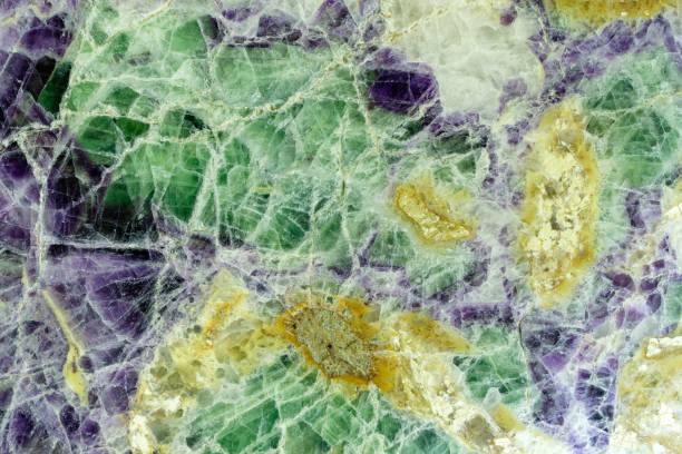 Beautiful decorative stone, natural green, blue and yellow stains abstract pattern stock photo
