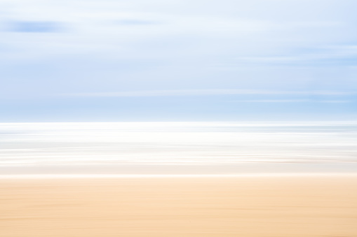 Intentional camera movement during exposure creating a blurred textural effect. Photographed at Raglan Beach, New Zealand.