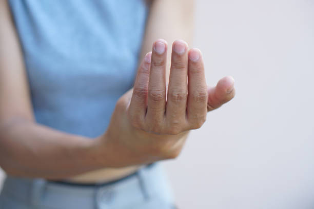 istock Asian woman having hand numbness 1485377097