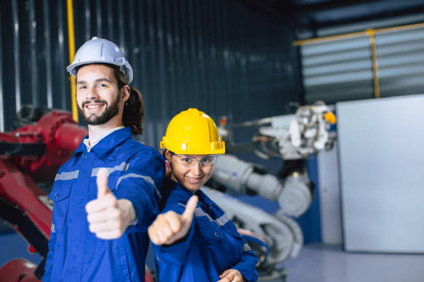 istock Engineer woman team worker work in Machine Robotic modern Automation Industry. Mechanic staff employee in metal factory. 1485377638