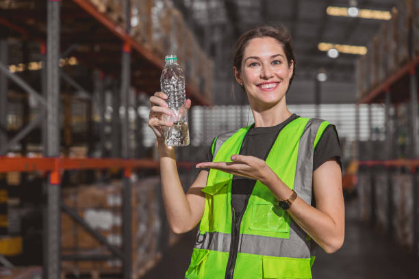 istock happy worker with drinking water bottle present drink clean water for fresh and healthy work in hot workplace 1485377968