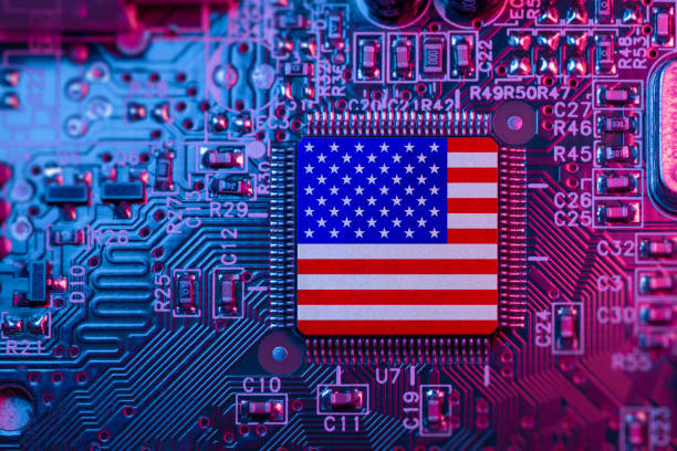 istock US flag on Computer Chips for Chip War Concept. USA Global chipmakers. Microchip on Motherboard with America world largest chip manufacturer and supply chain concept. 1485378430