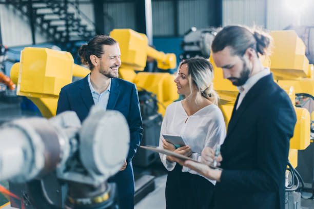 istock Engineer salesman marketing team working introduces modern technology machine products to lady business customer happy smile 1485379041