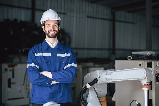 portrait hispanic caucasian technician engineer worker male standing confident happy smile