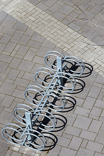 Abstract stainless steel bicycle racks in the shape of a racing bike.