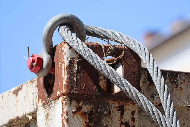 Steel wire rope on a rusty metal container