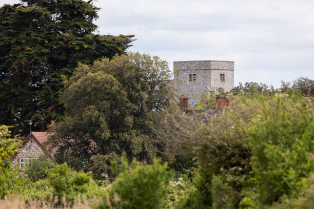 istock Thornham Village Church Over Trees 1485389151
