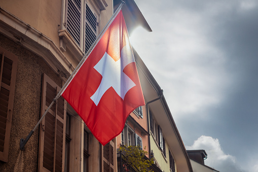 Swiss flag on fasade of the building