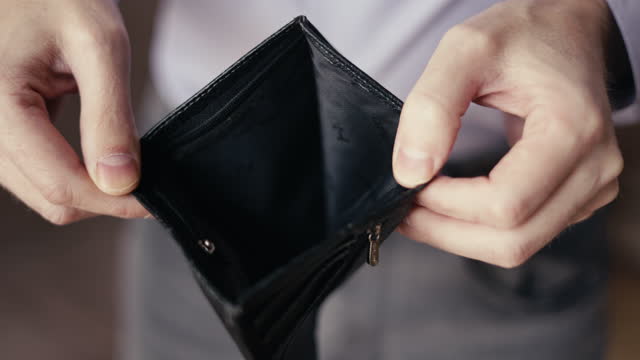 An empty wallet without money, a purse. financial difficulties, problems with work. economic crisis, low wages. family budget, high taxes and utility bills, mortgage