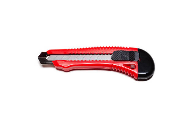 istock Red stationery knife on a white 1485392568