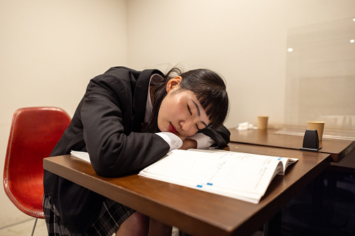 High school girl studying in cafe - napping
