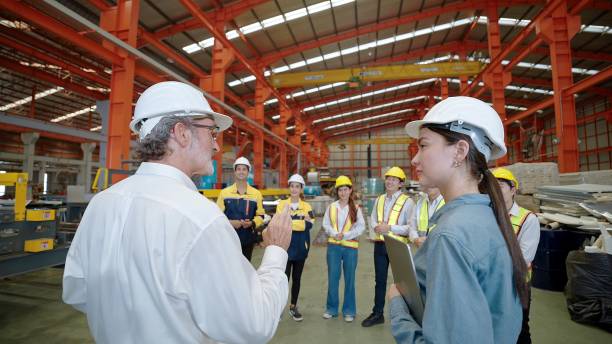 istock Manager leader team is assignmenting job and training for technicians attending brief meeting in the factory before work 1485394557