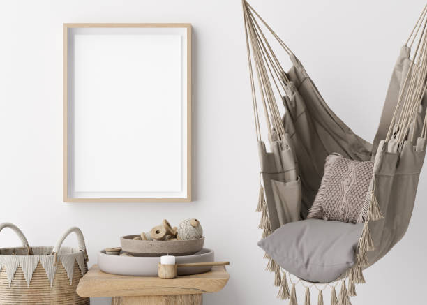 istock Blank vertical picture frame mockup in room. Boho style. Empty space for artwork, poster. Rattan basket, hanging macrame armchair. Wooden frame mock up, template. Close up view. 3D rendering. 1485395570