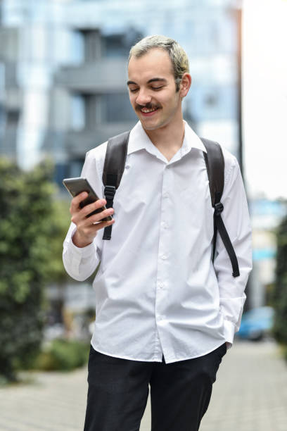 istock Modern Metrosexual Male Getting Ready To Put Finishing Make Up Touch Before Attending Business Meeting 1485397205