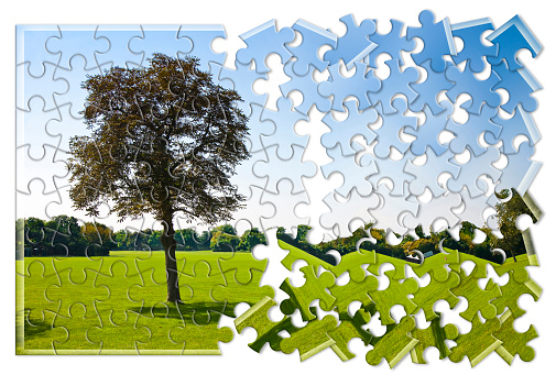Jigsaw puzzle pieces textured with European Union and Swiss flags on white. Horizontal composition with copy space. Clipping path is included.