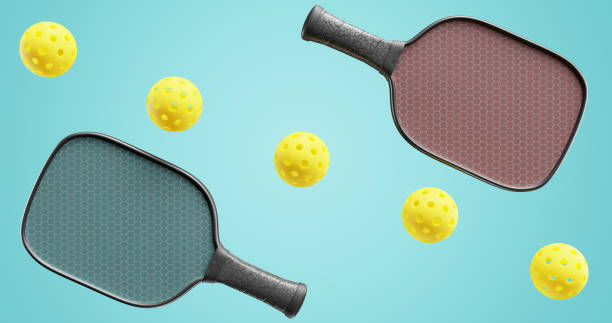 istock Pickleball multi-colored rackets and balls diagonally in a row. 3d rendering 1485399956