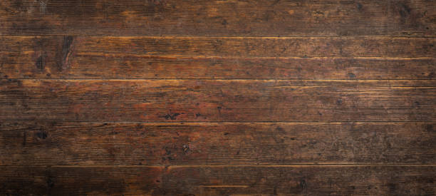 istock Old brown rustic dark grunge wooden timber wall or floor or table texture - wood background banner 1485402857