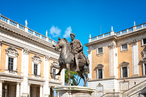 Statue of Roman Emperor Marcus Aurelius on horseback in front of the Palazzo Senatorio in the Piazza del Campidoglio in Rome, Italy