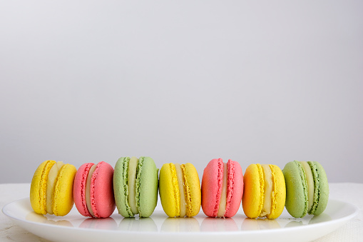 Sweet and colourful french macaroons or macaron on white background, Dessert. High quality photo