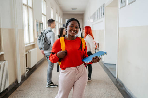 istock Young Female Student Standing In The Hall In University 1485410442