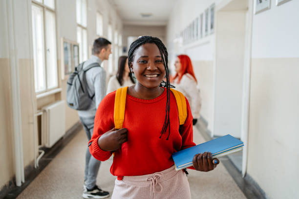 istock Young Female Student Standing In The Hall In University 1485411152