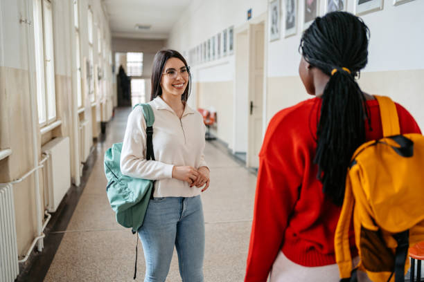 istock Two Female Students Talking In The Hall In University 1485411558