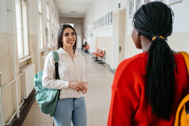 istock Two Female Students Talking In The Hall In University 1485411606