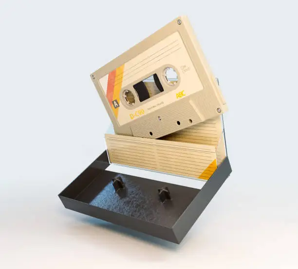 A concept of a recordable aduio cassette tape with a platic cover and cardboard insert - 3D render