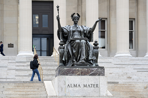 New York City, United States, April 7, 2023 - The statue of Alma Mater and the Low Memorial Library Building on the Columbia University campus on the Upper West Side of Manhattan in New York City. The statue's name is Alma Mater (nurturing mother), created in 1903 by noted artist Daniel Chester French.