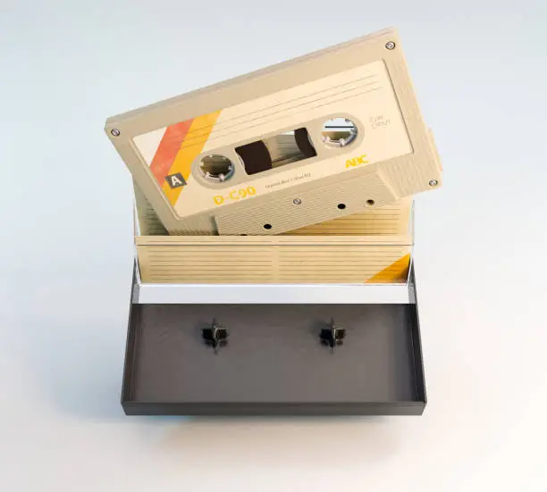 A concept of a recordable aduio cassette tape with a platic cover and cardboard insert - 3D render