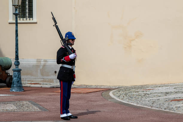 Monaco Ville, Principality of Monaco - January 04 2025: Royal entrance of the Prince's Palace, with a carabiniere guard.