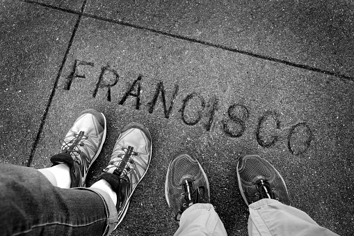 Feet of people walking on Francisco Street in California