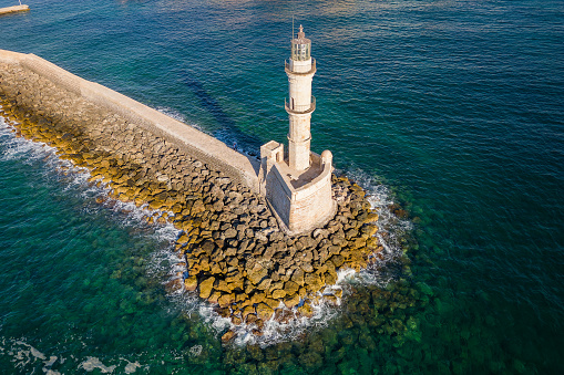 Aerial view of a lighthouse and the old Venetian harbor in the Greek town of Chania on the island of Crete
