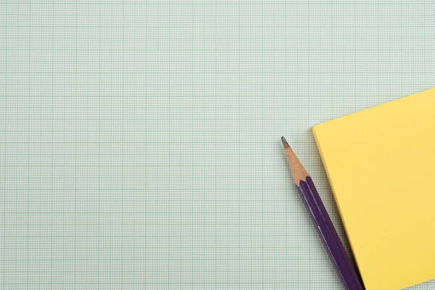 Notepad with a spiral binding and checkered sheets.