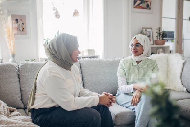 istock Two Indian women sitting on sofa 1485424130