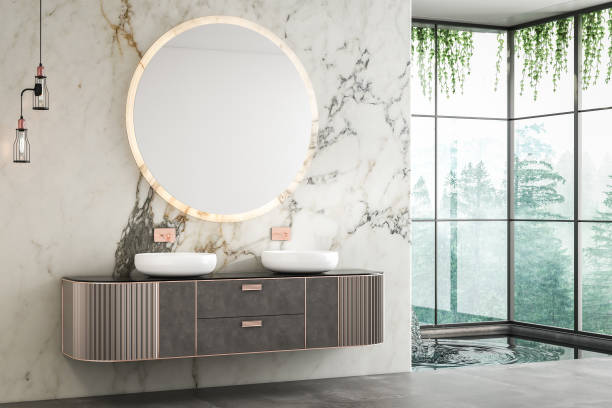 istock A luxurious bathroom with a double sink vanity, marble walls, concrete flooring, a small pool, and a forest view from the window.3d rendering 1485426475