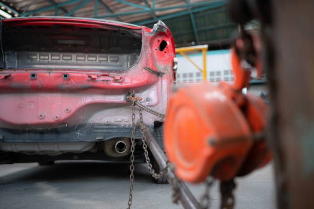 istock The car crashed so hard that the car body collapsed into distortion. A car body puller is required to restore the car body to its original shape. 1485438154