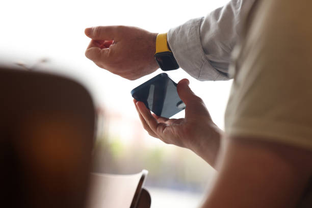 istock Man making NFC payment with his smart watch 1485438576