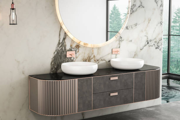 istock A luxurious bathroom with a double sink vanity, marble walls, concrete flooring, a small pool, and a forest view from the window.3d rendering 1485438732