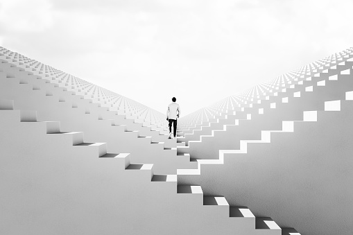 Businessman walking between endless abstract  stairs. 3D generated image.