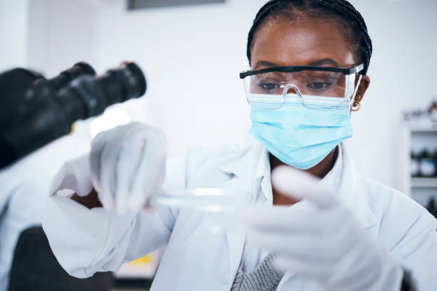 istock Science, covid and solution with a black woman doctor working in a laboratory for research or innovation. Medical, analytics and development with a female scientist at work in a lab for chemistry 1485440785