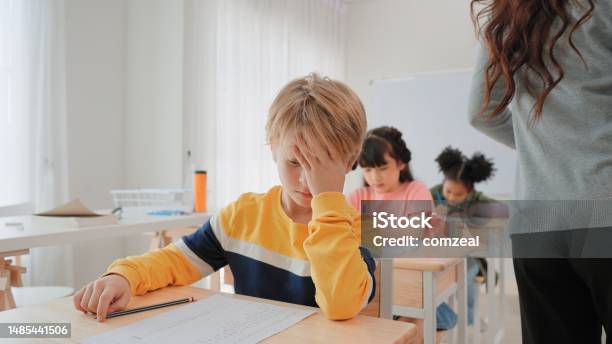 Elementary School Students Boy Are Stressing About Doing Their Final Exams In The Exam Room At School Stock Photo - Download Image Now
