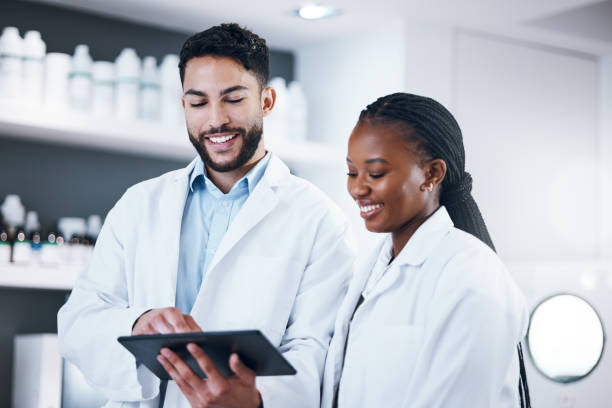 istock Science research, tablet and scientist people with pharmaceutical report, medicine data and digital analysis. Medical professional, black woman or internship partner in laboratory for online feedback 1485442570