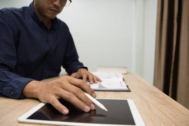 Businessman working at office with Digital tablet laptop computer smart phone using.