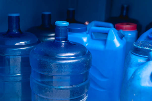 istock Cylindrical and opaque box type HPDE water containers at a refilling station. 1485443300