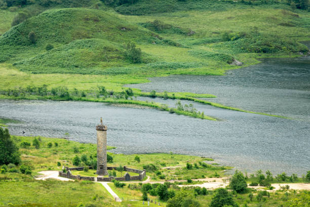 Aerial view of the Glenfinnan monument and Loch Shiel in North West Highlands, Scotland, UK Aerial view of the Glenfinnan monument and Loch Shiel in North West Highlands, Scotland, UK glenfinnan monument stock pictures, royalty-free photos & images