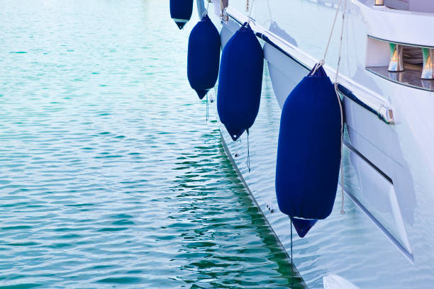 istock Bumpers protection between two moored boats in a small harbour 1485447711