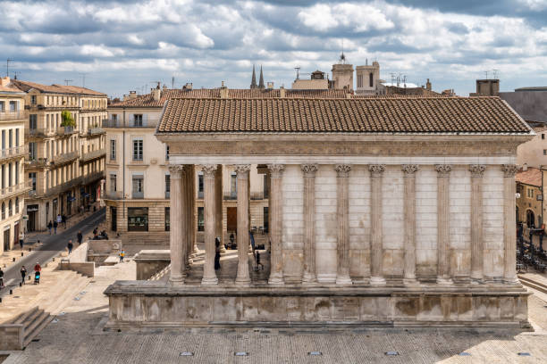 April 26, 2023: Maison Carrée, the Roman temple in Nimes, France. Photo taken during a warm spring afternoon and contains some people.